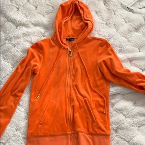 Women’s orange Juicy Couture zip up sweater